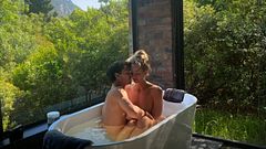 Making love in the bath surrounded by nature